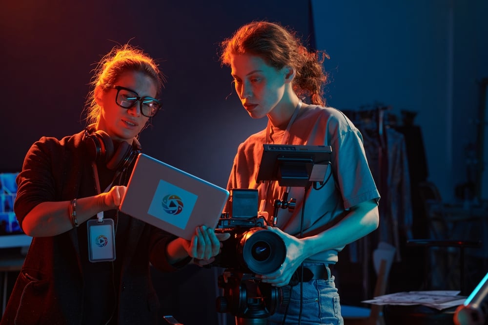 Video editors reviewing footage on a monitor during post-production