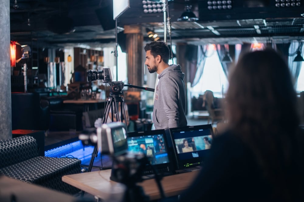 Videographer filming a training video using a professional camera rig